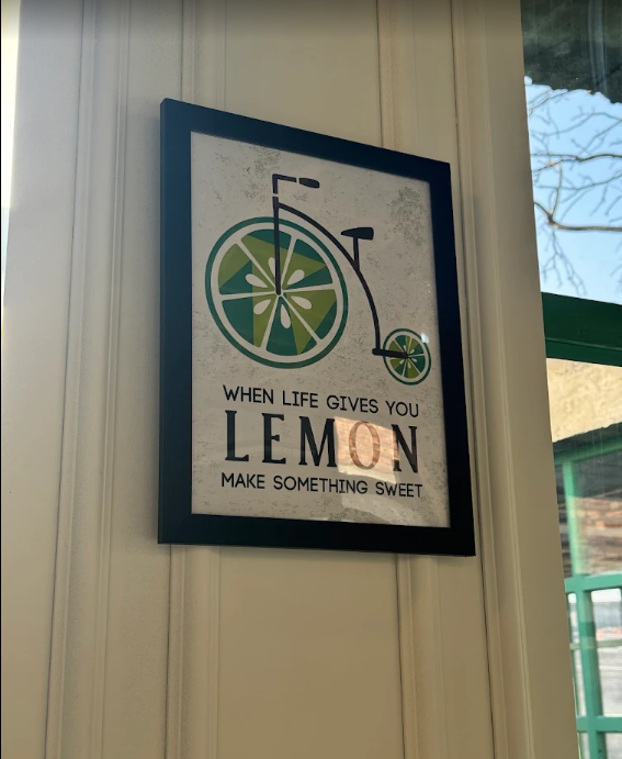 Framed lemon bicycle artwork on the cafe wall
